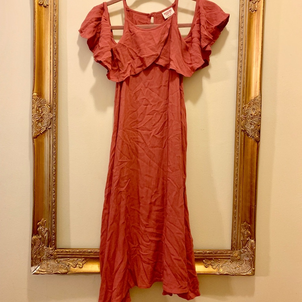 coral dress with cold shoulder and draped sleeves